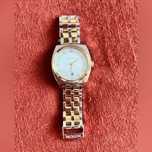 Nixon monopoly womens watch. Yellow and gold with white face.
